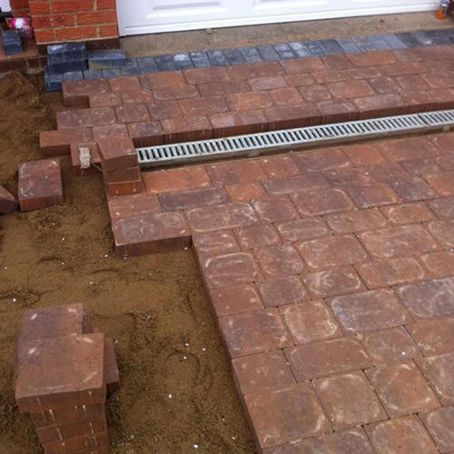 Block paving driveway being laid with edge courses and a channel drain, Darlington